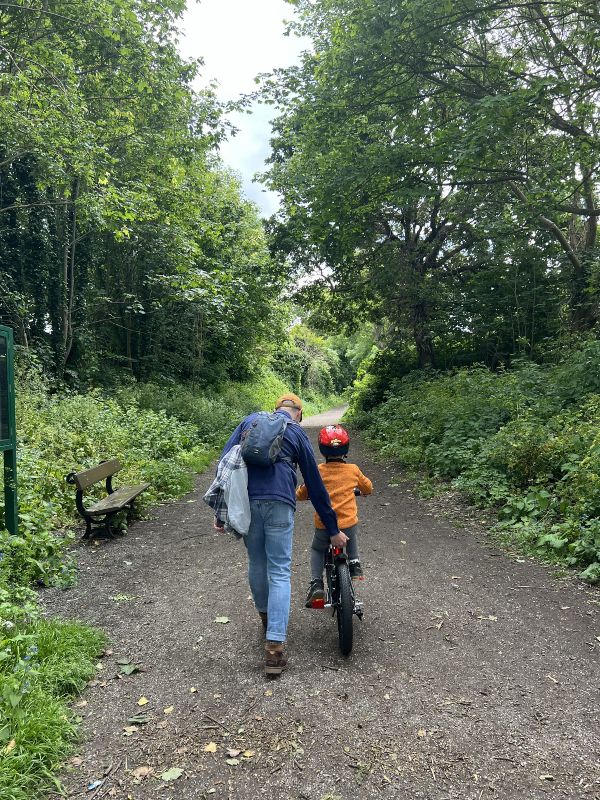 Little boy learning to ride a bike on the Wirral Way. Little boy learning to ride a bike on the Wirral Way.