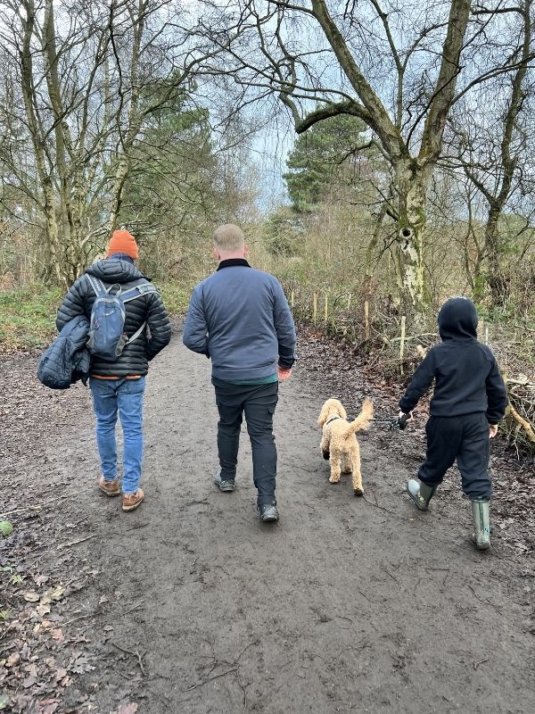 Family walking in Wirral in the winter.