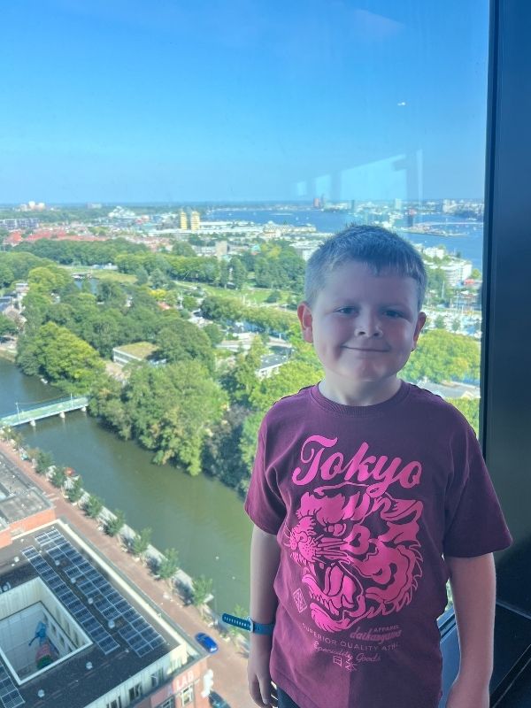 Kid at the top of ADAM with view of Amsterdam. Kid at the top of ADAM with view of Amsterdam.