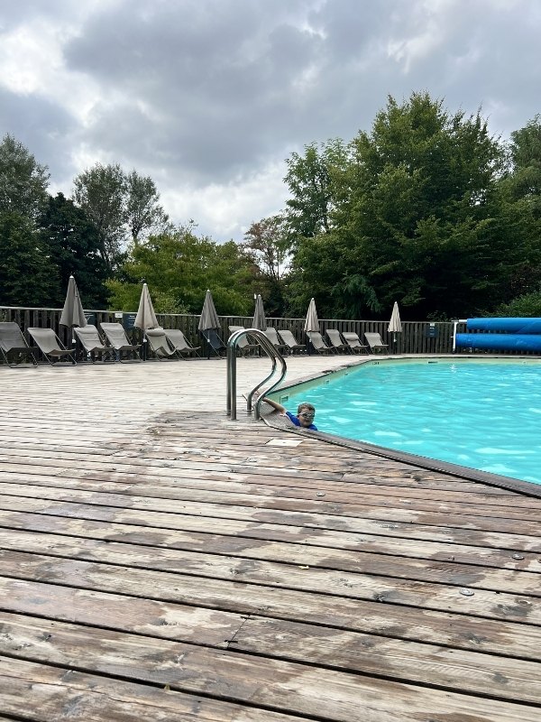 Camping de Lyon pool on our interrailing with kids trip.