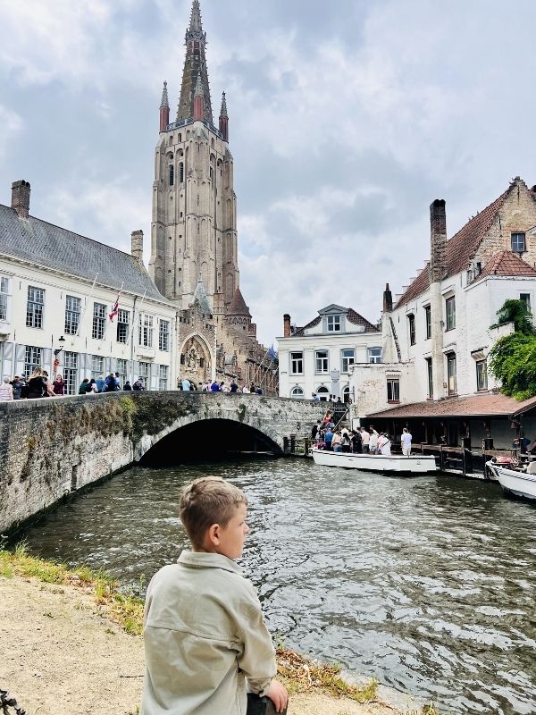 Little boy in Bruges on our interrailing with kids trip.